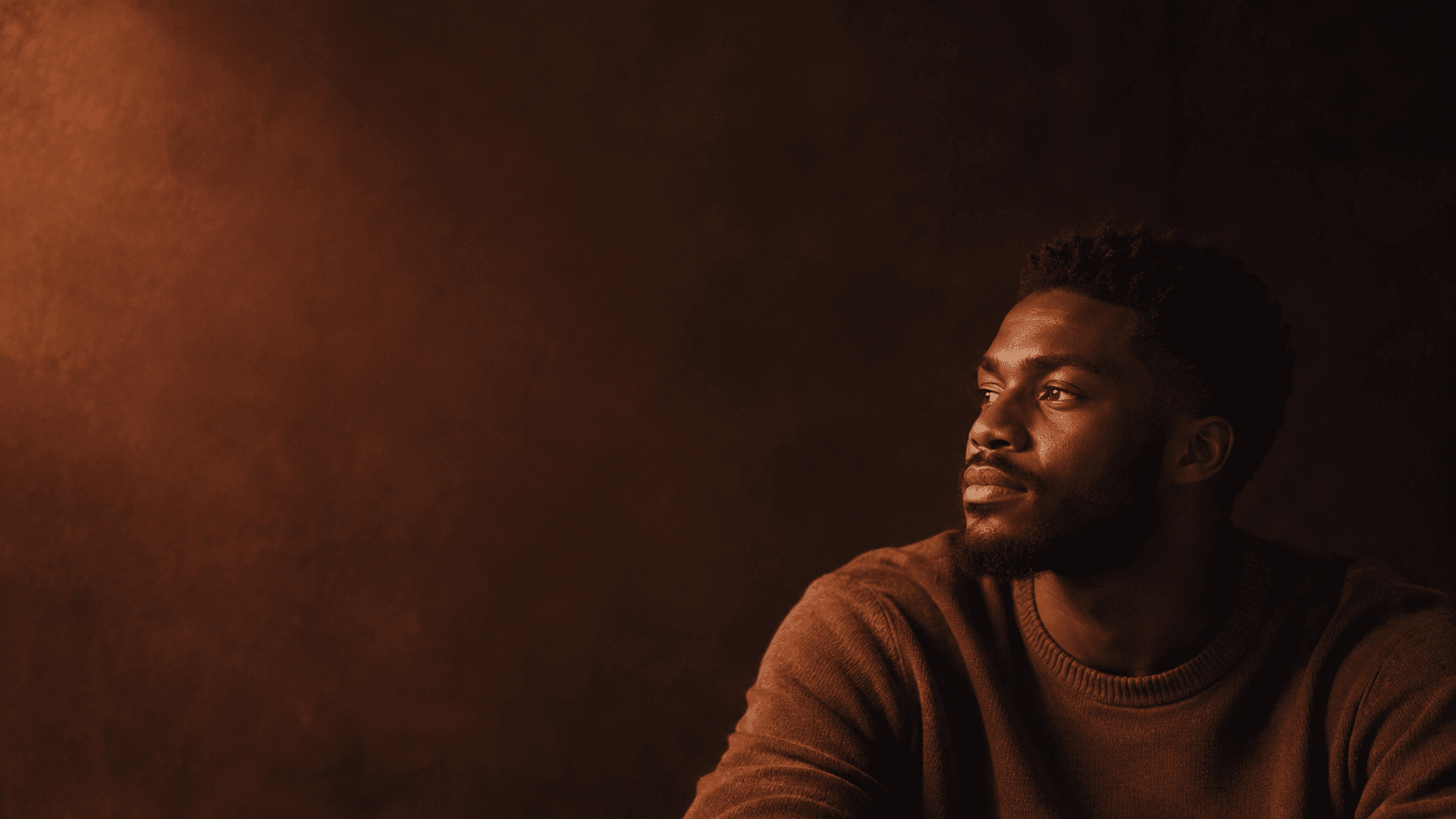 A person looking ahead in a quiet, reflective moment